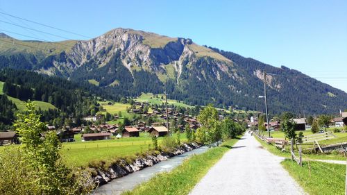 Scenic view of mountains against clear blue sky