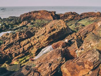 Scenic view of sea with rocks in background