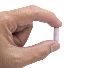 Close-up of human hand against white background