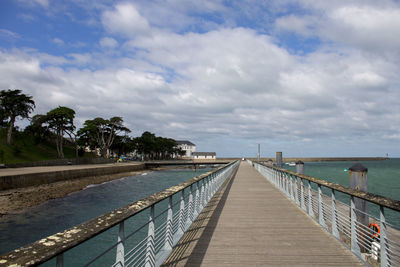 Pier over sea against sky