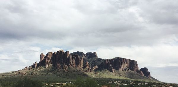 Rocky landscape against clouds