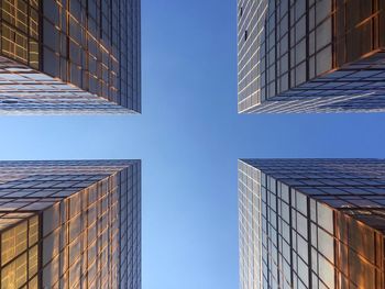 Low angle view of modern buildings against sky