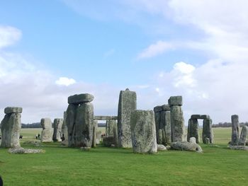 Stonehenge on land against sky