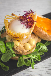 Close up of a delicious grilled chicken and egg burgers with mustard sauce