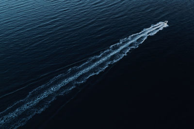 High angle view of rippled sea against blue sky