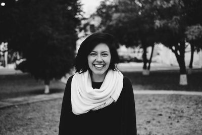 Portrait of a smiling young woman in park