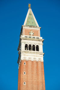 Campanile of basilica of saint mark on blue sky background. venice, italy