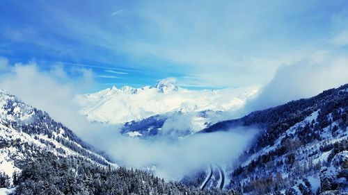 Scenic view of snowcapped mountains against sky