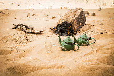 High angle view of toy on sand at beach