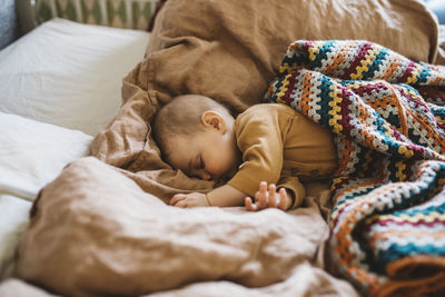 Baby sleeping on bed