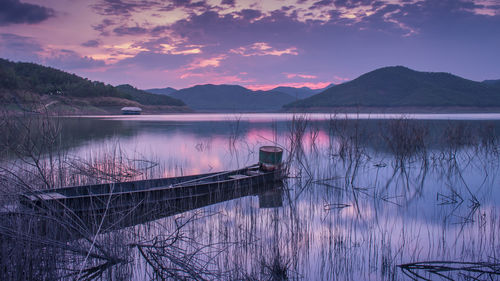 Scenic view of lake against sky during sunset