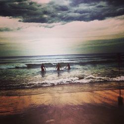 Scenic view of sea against cloudy sky