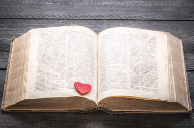 Close-up of heart shape on book