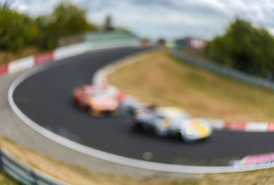 Close-up of car on road