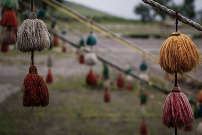 Close-up of decoration hanging against sky