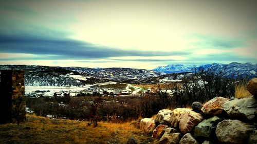 Scenic view of landscape against cloudy sky