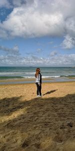 Full length of man on beach against sky