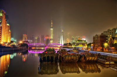 Illuminated buildings in city at night