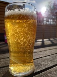 Close-up of beer glass on table