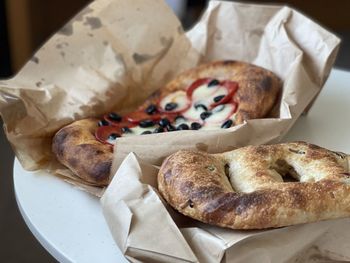 Close-up of bread and pizza on table