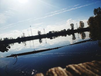 Scenic view of lake against sky during winter