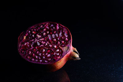 Close-up of strawberry against black background