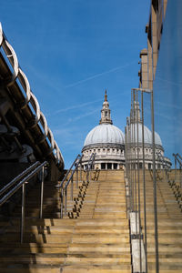 Low angle view of temple and building against sky