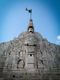 Low angle view of temple against clear blue sky