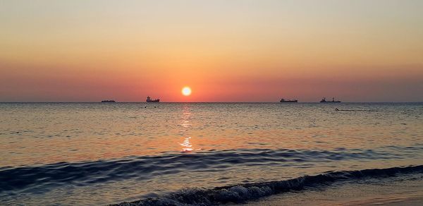 Scenic view of sea against sky during sunset