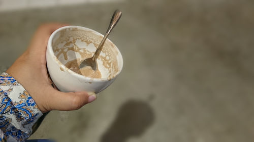 Close-up of hand holding ice cream