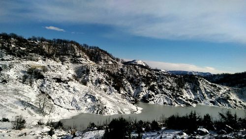 Scenic view of mountains against sky during winter