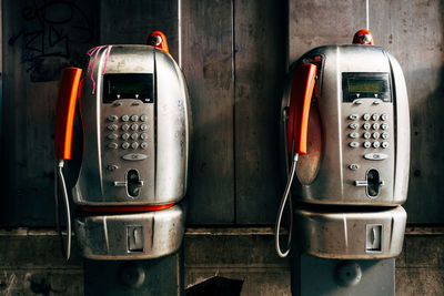 Close-up of telephones in booth