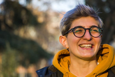 Young adult woman portrait at sunset in the park, tbilisi, georgia