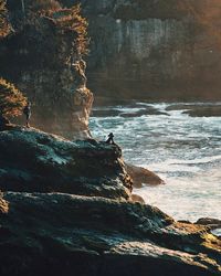 Scenic view of sea by cliff