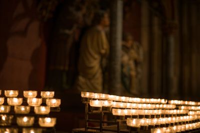 Illuminated candles in temple