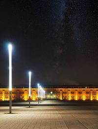 Illuminated building against sky at night