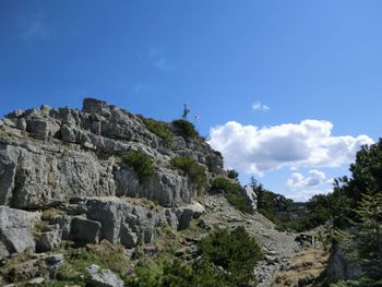 Scenic view of rocky mountains against blue sky