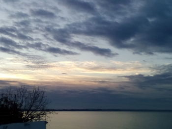 Scenic view of sea against sky at sunset