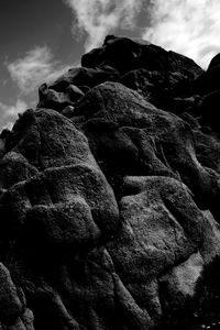 Low angle view of rock formation against sky