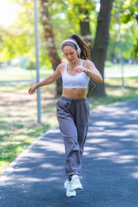 Young woman exercising on field