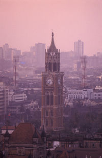 Buildings in city against clear sky