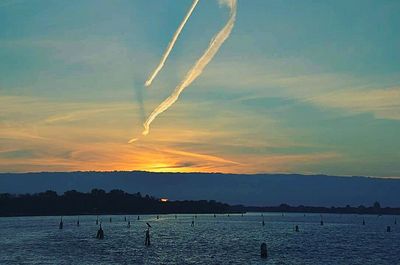 Scenic view of sea against sky at sunset