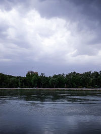 View of lake against cloudy sky