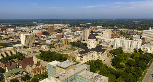 High angle view of buildings in city against sky