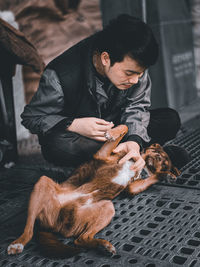 Full length of man with dog