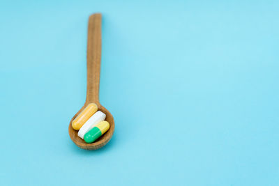 High angle view of blue container on table