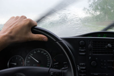 Close-up of hand holding car