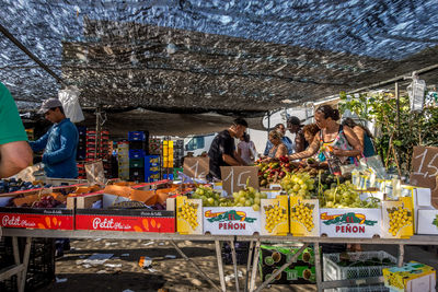 People at market stall