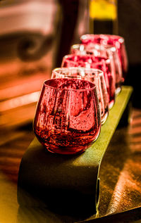 Close-up of red drinking glasses on table