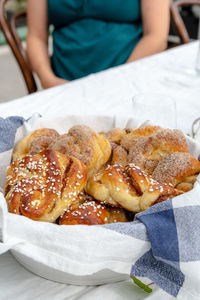 Close-up of woman holding food in plate
